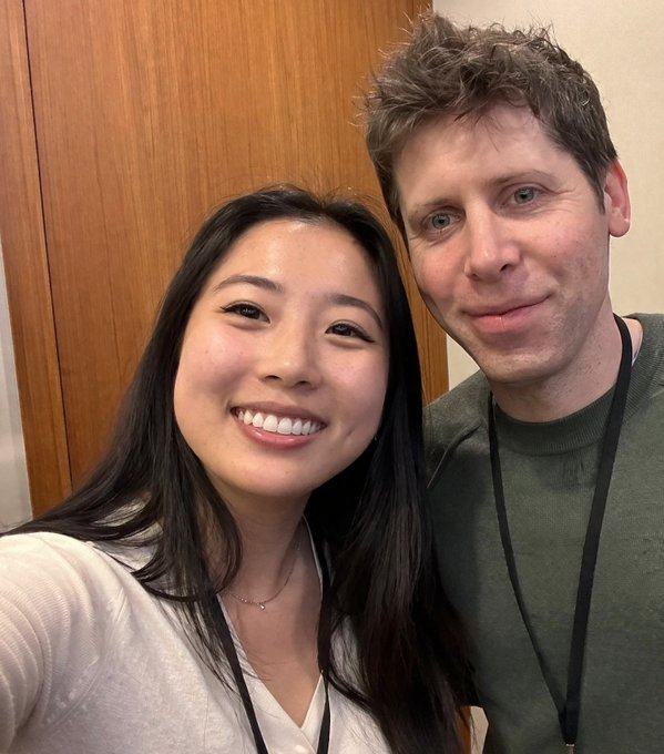 Young Woman Taking Selfie With Sam Altman